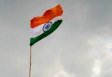 Indian flag waving against a cloudy sky