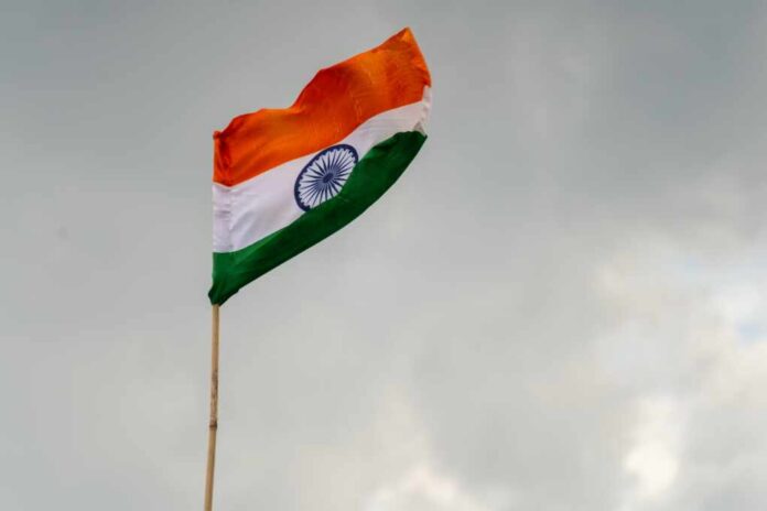 Indian flag waving against a cloudy sky