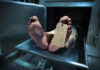 Unbelievable! Bodies Turned Into Liquid Waste Feet of a deceased person on a metal table with an identification tag