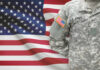 U.S. Army soldiers uniform with American flag in the background