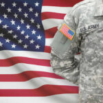 U.S. Army soldiers uniform with American flag in the background