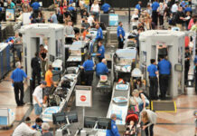 TSA Crisis: 450 Quit Amid Shutdown Chaos Busy airport security checkpoint with travelers and TSA agents