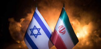 Flags of Israel and Iran displayed against a smoky background