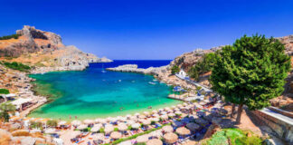 A picturesque beach with turquoise water and sun umbrellas