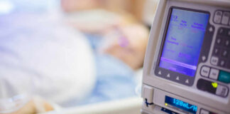 IV pump displaying medication flow rate in a hospital room
