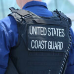 Coast Guard officer in uniform with a visible badge