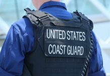 Coast Guard officer in uniform with a visible badge