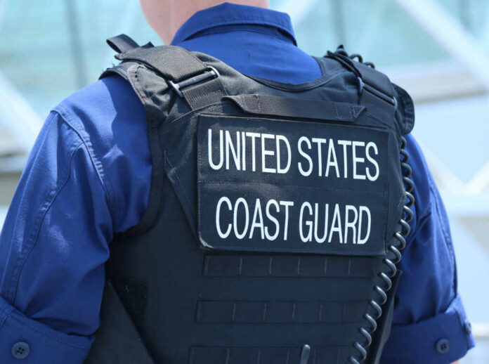 Coast Guard officer in uniform with a visible badge