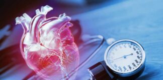 An anatomical heart illustration next to a blood pressure monitor