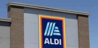ALDI grocery store sign against a clear blue sky