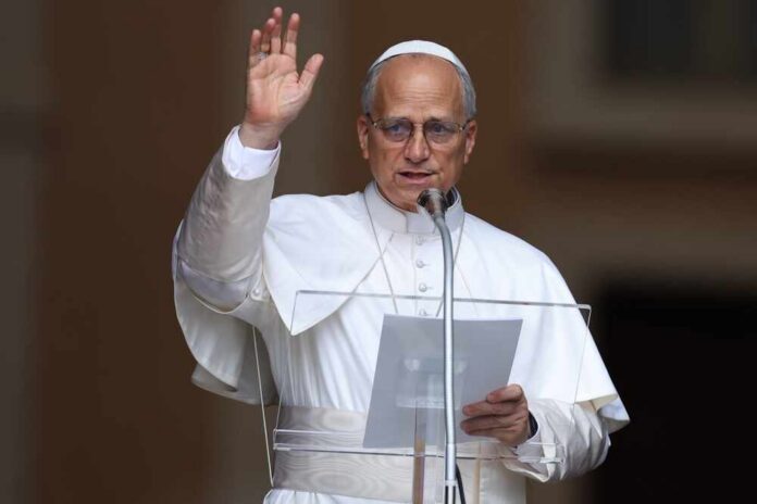 Religious leader giving a speech outdoors with a raised hand