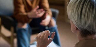 Two individuals engaged in a conversation during a counseling session