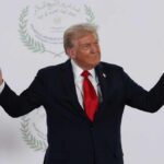 Trump Clashes with Reporter Over Iran Policy Donald Trump gesturing during a political event