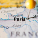 Close-up of a map highlighting Paris with a location pin