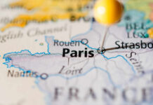 Close-up of a map highlighting Paris with a location pin