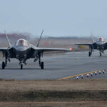 Trump’s Bold $20B Fighter Deal Rocks Industry Two F-35 fighter jets taxiing on an airfield