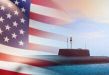 A submarine partially submerged in water with an American flag overlay