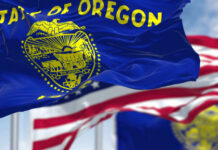 Oregon’s Anti-Cruelty Law: Farmers in PANIC Oregon state flag waving in front of an American flag