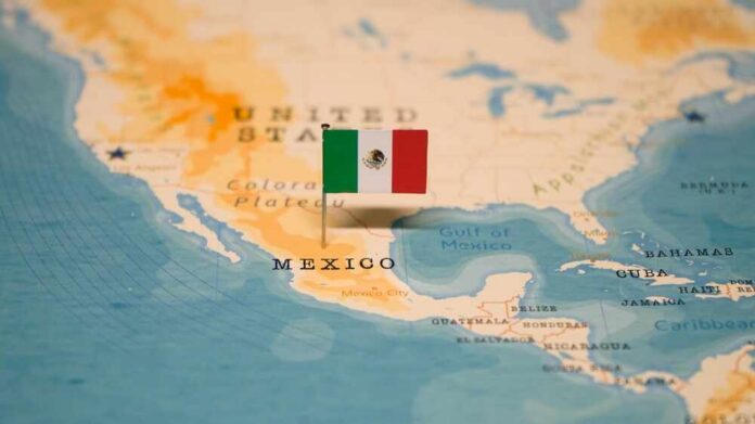 The,Map,And,Flag,Of,Mexico. Map of North America with a flag of Mexico pinned on it
