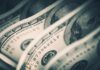 Close-up of folded hundred dollar bills