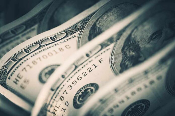 Close-up of folded hundred dollar bills