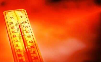Thermometer showing high temperature against a red hot background