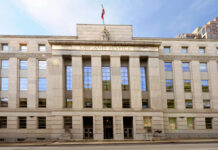 Killer Caged—Prosecutors Skip One Murder Facade of a government building with the words Law and Justice and a statue on top