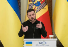 G7 Dangles Missiles Inside Ukraine Ukrainian leader delivering a speech at a podium with national flags in the background