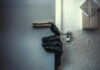 MS-13 Carnage, Evidence Gaps A gloved hand reaching through a partially opened door