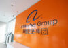 Alibaba Group logo on orange office wall