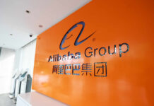 Alibaba Group logo on orange office wall