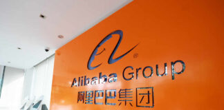 Alibaba Group logo on orange office wall