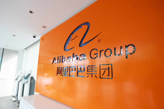 Alibaba Group logo on orange office wall
