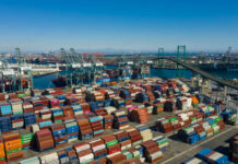 Aerial view of a busy shipping port filled with colorful cargo containers