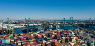Aerial view of a busy shipping port filled with colorful cargo containers