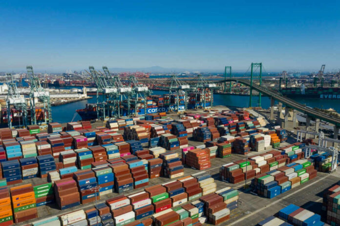Aerial view of a busy shipping port filled with colorful cargo containers