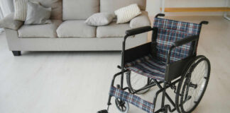 A wheelchair with plaid fabric in a living room setting