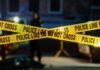 Trafficked Teen Identified — 26 Years Later Police tape marking a crime scene with blurred figures in the background