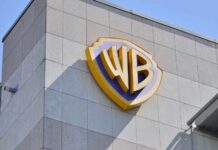 DOJ Greenlights $110B Media Beast Warner Bros logo displayed on a building exterior