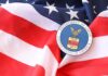 U.S. Department of Labor seal on an American flag