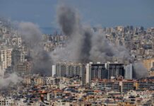 Beirut Blasts After ‘Ceasefire’ Push Smoke rising from buildings in a densely populated urban area