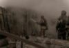 Missiles Obliterate Kyiv Grocery Hub Firefighters spray water into a smoke-filled structure