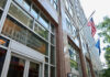 Exterior view of the United States Social Security Administration building with flags