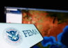 FEMA Holdback Triggers Election Brawl FEMA logo in front of a geographic map on a computer screen