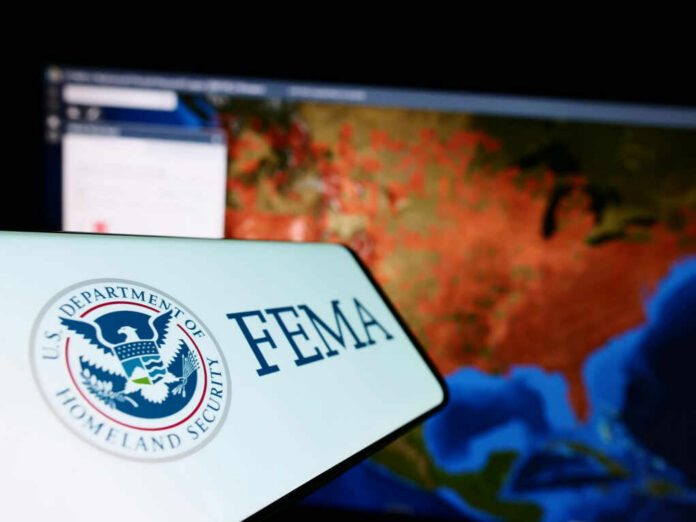 shutterstock2248583203-1jpg FEMA logo in front of a geographic map on a computer screen