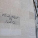 DOJ Goes Nuclear On Passports Department of Justice building exterior with American flags