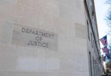 DOJ Goes Nuclear On Passports Department of Justice building exterior with American flags