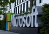 Microsoft logo displayed prominently outside a modern office building