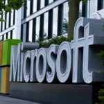 Microsoft logo displayed prominently outside a modern office building