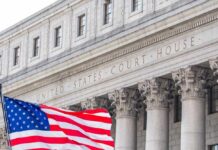 Judge Drops MAX Sentence On Army Captain Facade of a United States courthouse with an American flag in the foreground
